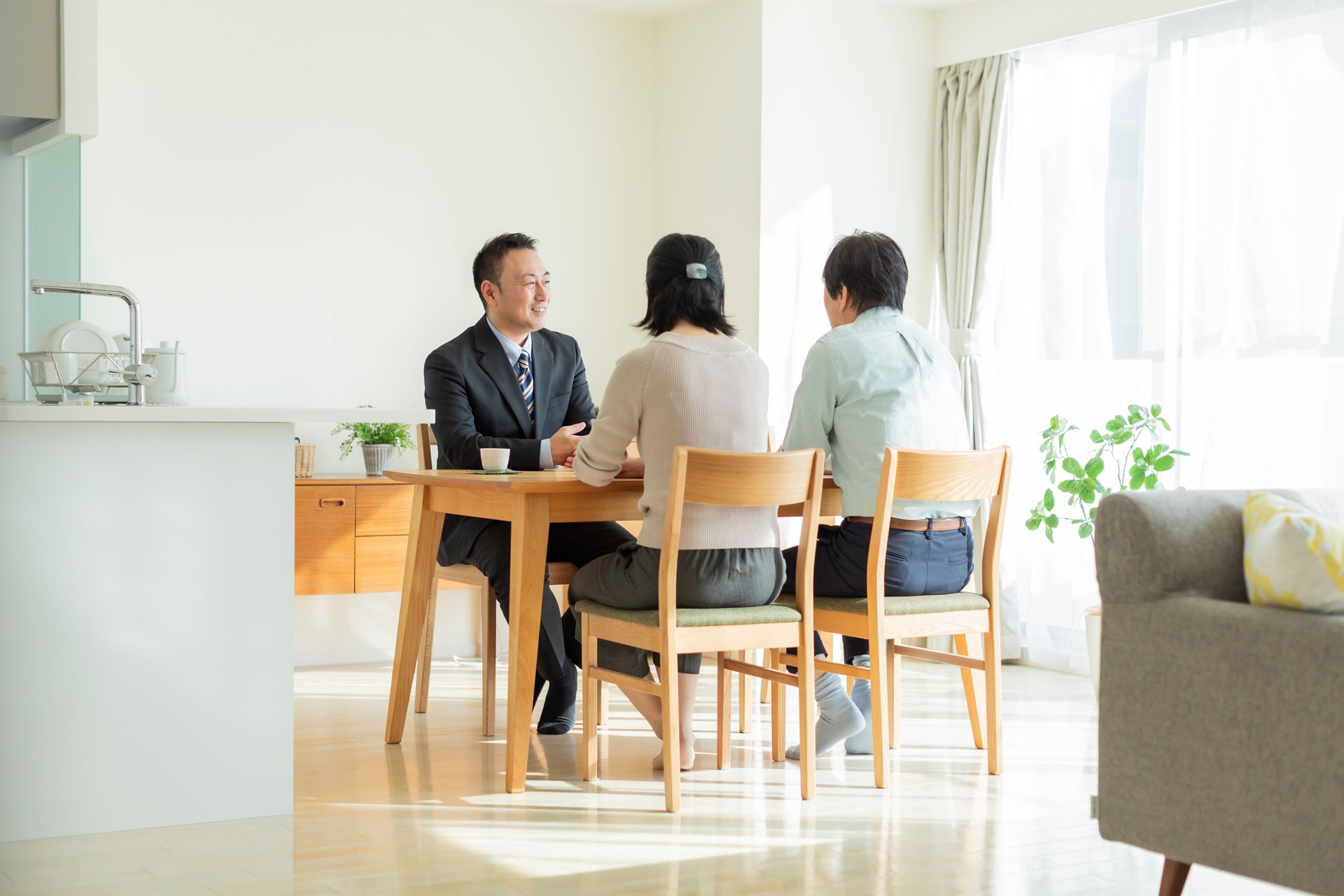 Businessman explaining to middle aged couple